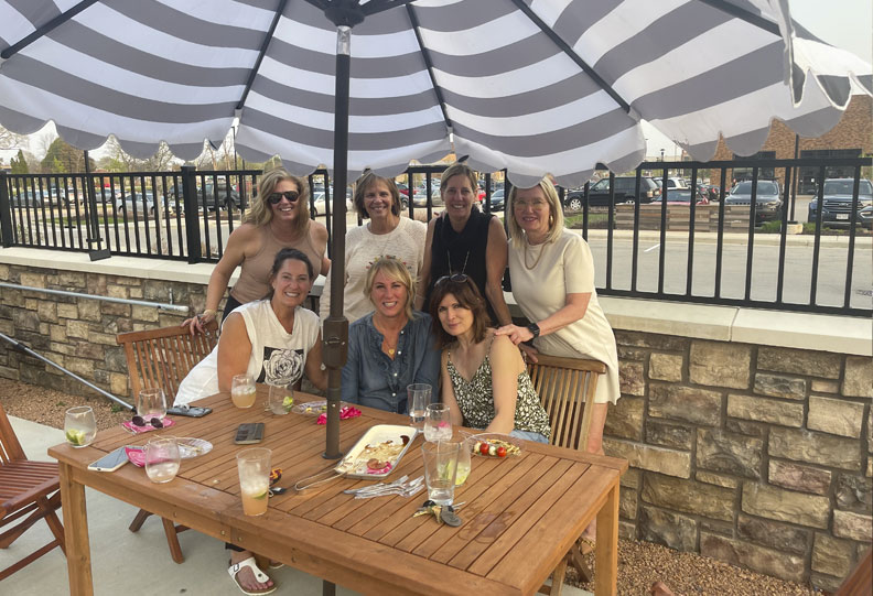 group of women posing for a photo